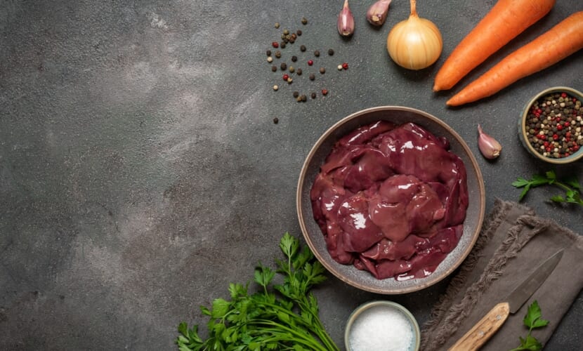 Raw,Chicken,Liver,In,Bowl,With,Spices,,Carrots,,Onions,On