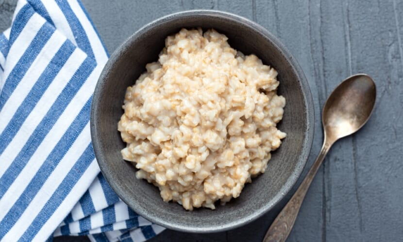 Steel,Cut,Oatmeal,Bowl.,Cooked,Oats.,Top,View,,Copy,Space