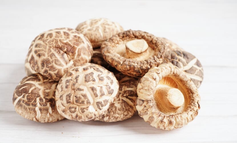 Dried,Shiitake,Mushroom,On,Wooden,Background.,Healthy,Food.