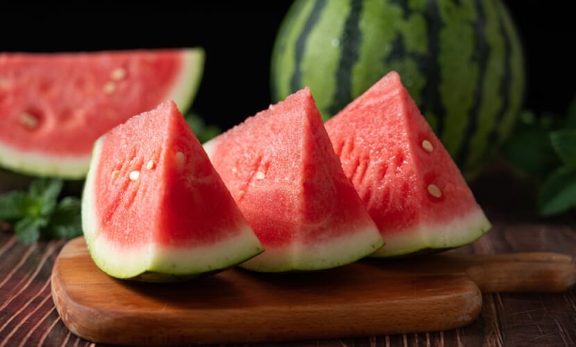 Slices,Of,Fresh,Watermelon,On,The,Rustic,Wooden,Table
